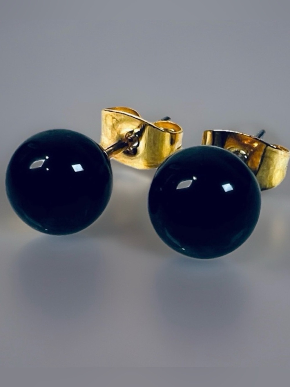 Beautiful weighted, black goldtone, stud pierced earrings